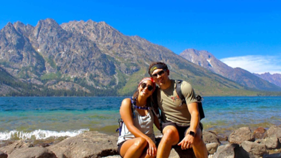 Ana and fiancee in front of mountain landscape