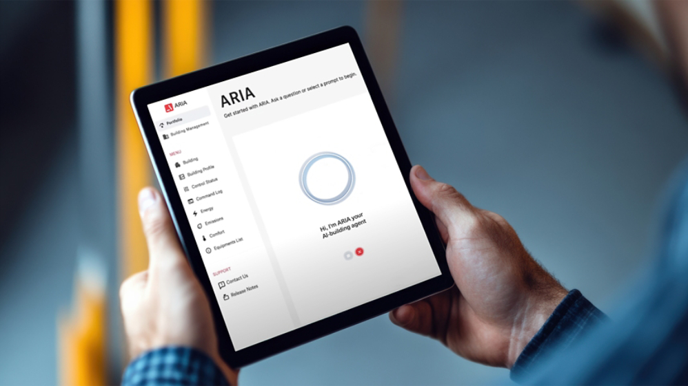 Worker holding digital tablet with blank white screen in warehouse
