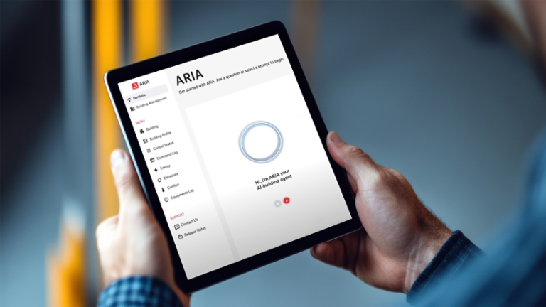 Worker holding digital tablet with blank white screen in warehouse