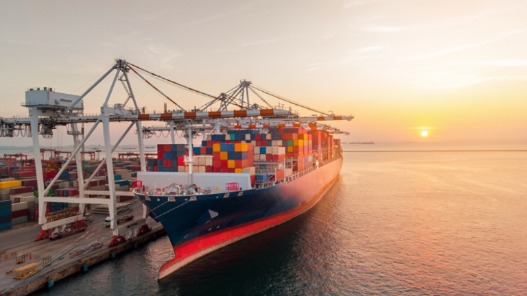 Crane loading cargo container to container ship stand by in the international terminal logistic sea port  concept freight shipping by ship at sunset