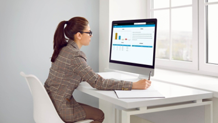 Women analzying centralized billing dashboard