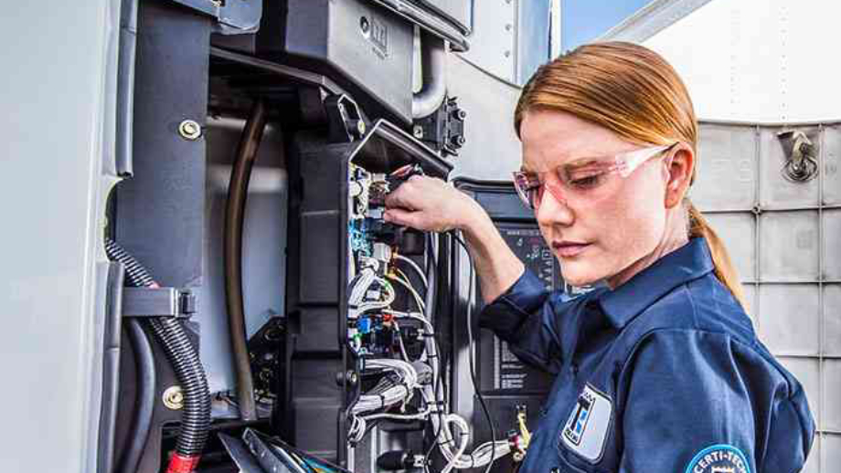 female maintenance technician working on a Thermo King unit