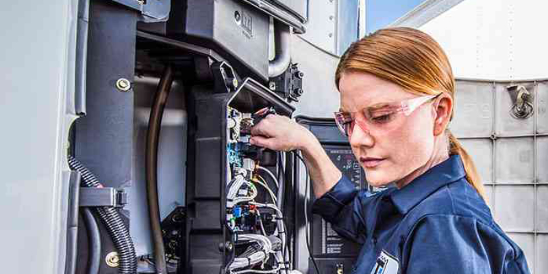 female maintenance technician working on a Thermo King unit