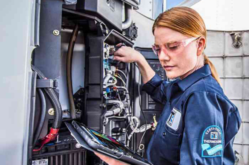 female maintenance technician working on a Thermo King unit
