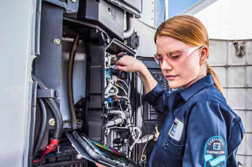 female maintenance technician working on a Thermo King unit