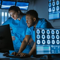 Male and Female Scientists / Neurologists, Talking and  Working on a Personal Computer in Modern Laboratory. Research Medical Scientists Making New Discoveries in the fields of Neurophysiology, Science,  Neuropharmacology. Understanding Human Brain.