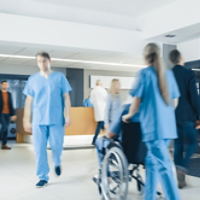 Hospital Lobby. Doctors, Nurses, Assistant Personnel and Patients Working and Walking in the Lobby of the Medical Facility.