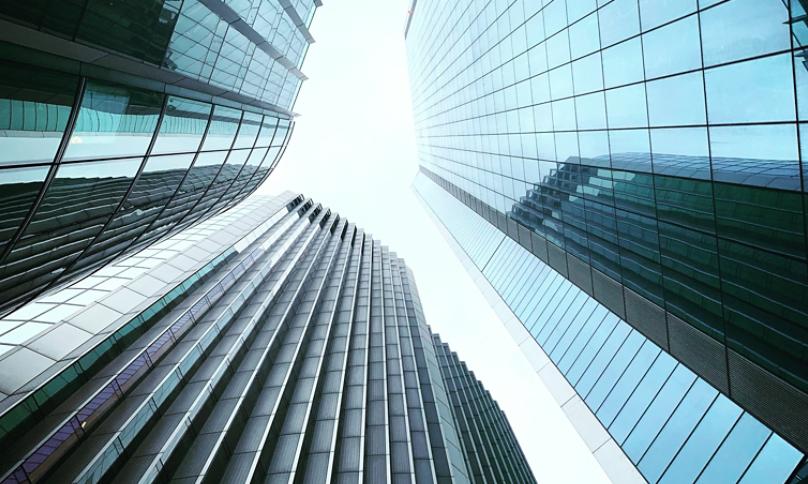 Three Buildings Looking towards bright sky