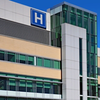 Modern style building with large H sign for hospital