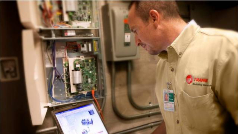 Trane worker checking on system