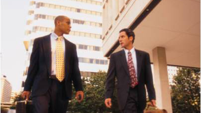 Businessmen walking on street