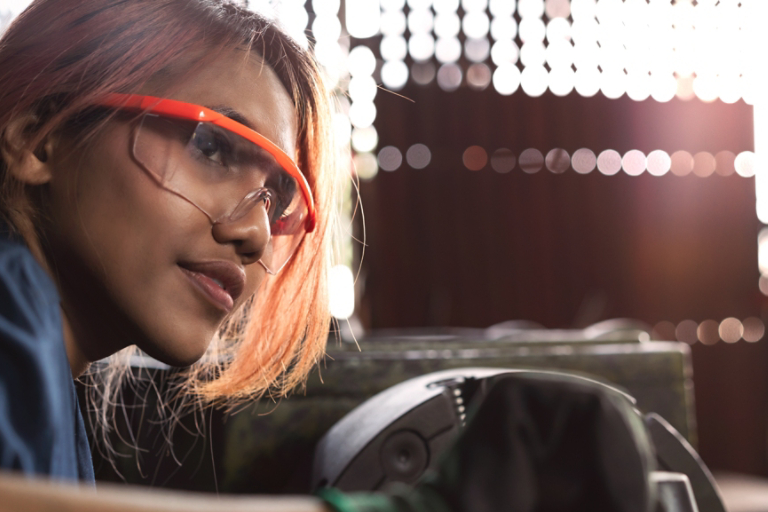 male mechanical engineer operating heavy industrial machinery 