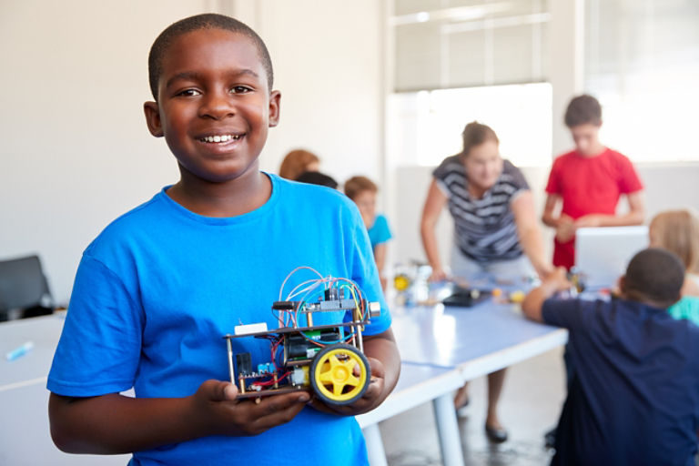 Young Student Building a Robot