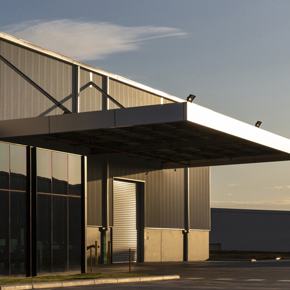 Industrial office & warehouse architecture bathed in afternoon light.