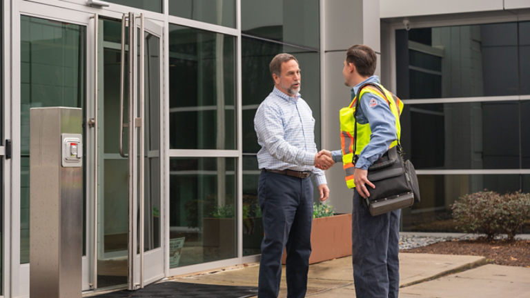 Technician Greeting Employee at Door