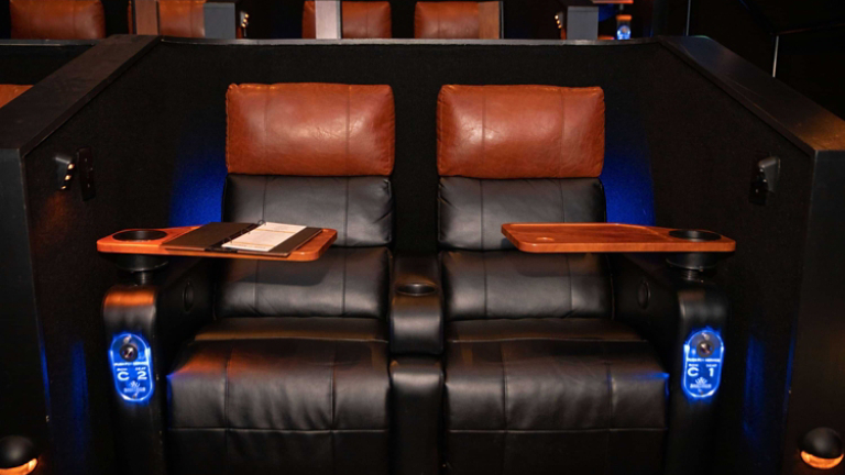 Santikos Theater leather seats with tables