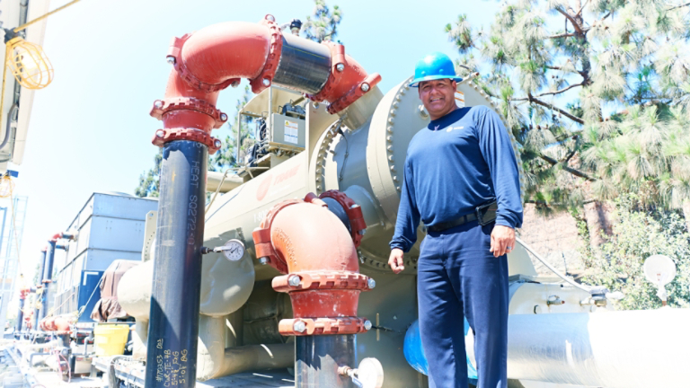 Technician in Front of Rental Unit