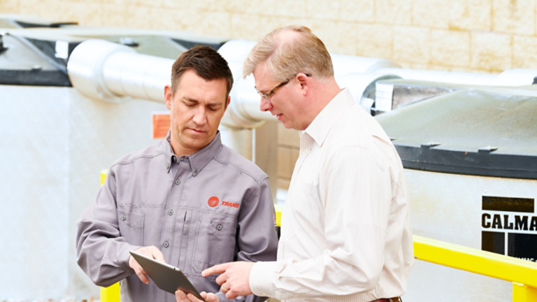 A Trane technician demonstrates Connected Mechanical Services.