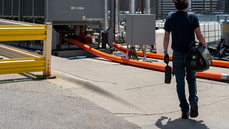 Technician walking to Work on Rental Unit