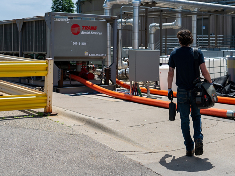 Technician walking to Work on Rental Unit