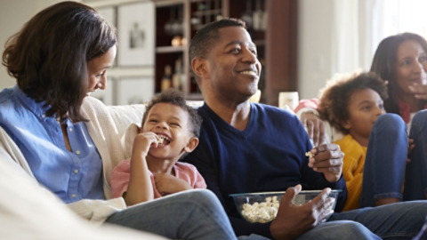 Family on Couch Eating Popcorn