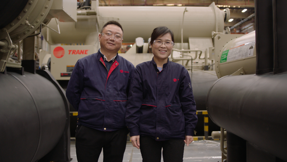 Female and Male Smiling by Equipment