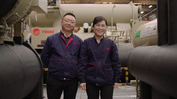 Female and Male Smiling by Equipment