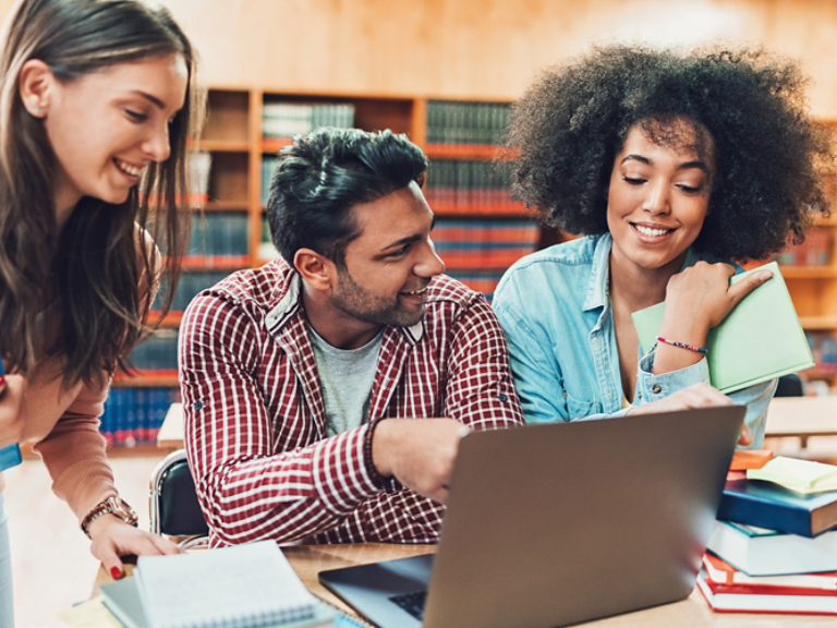 people smiling in library
