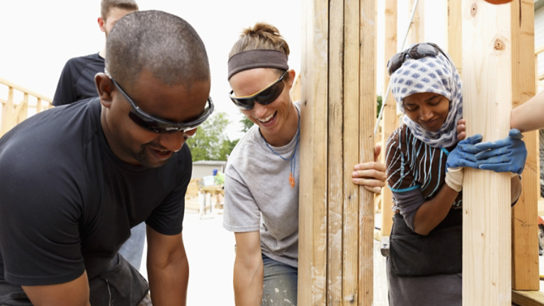 People building a house