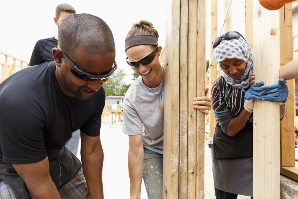 People building a house