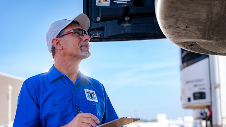 Thermo King Technician Looking at Open Precedent Unit