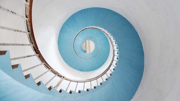 view looking up at circular staircase