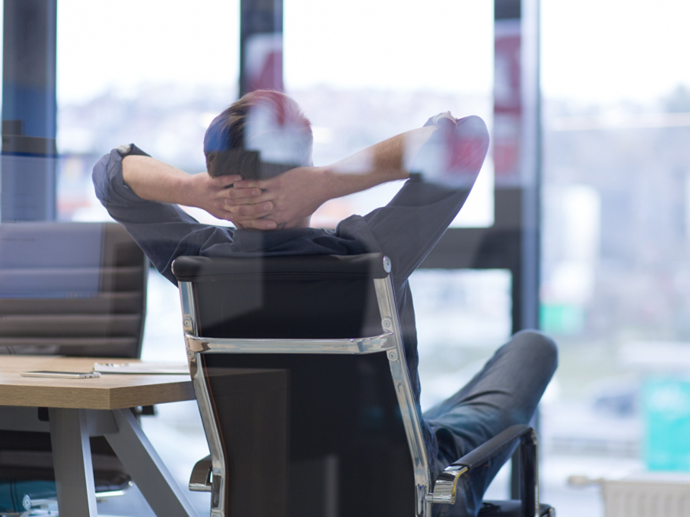 young businessman relaxing at the desk