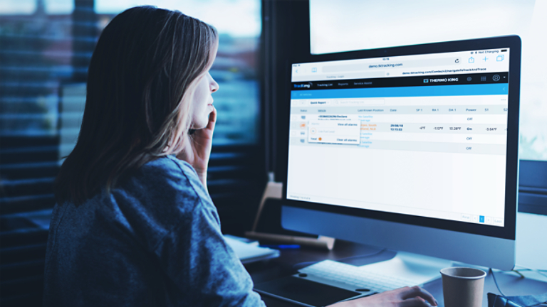 Woman looking at TracKing telematics demo