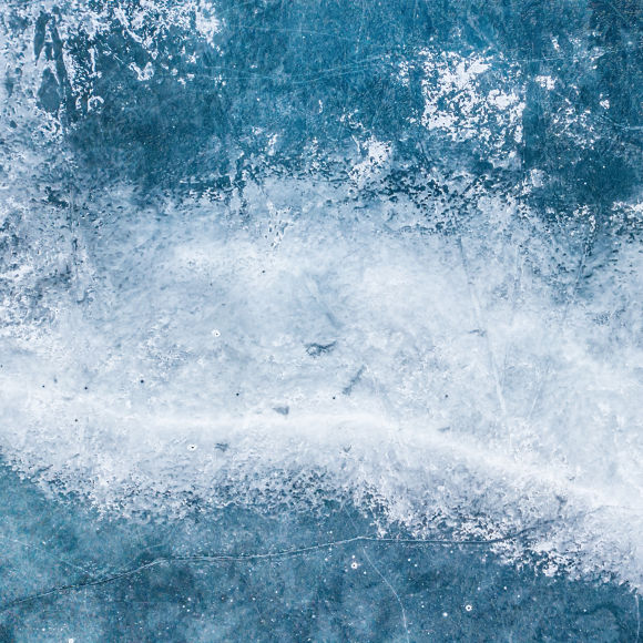 Cracked frozen lake surface