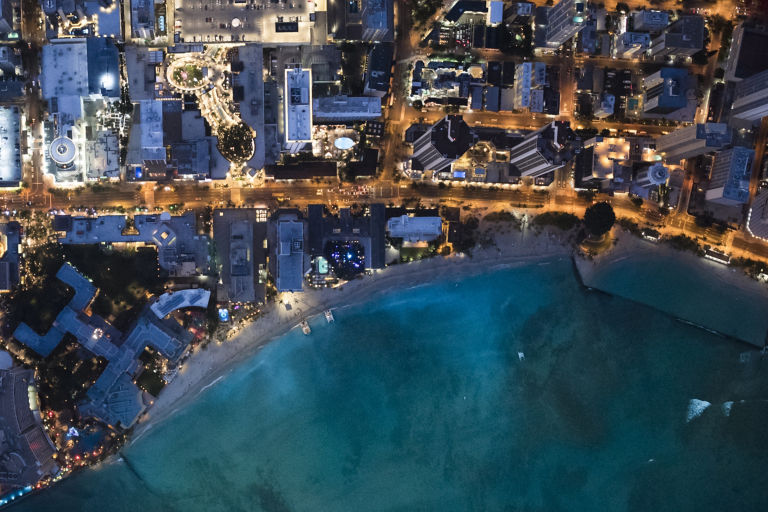Busy coastal city at dusk 
