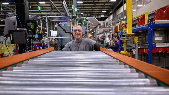 Male employee working on assembly line