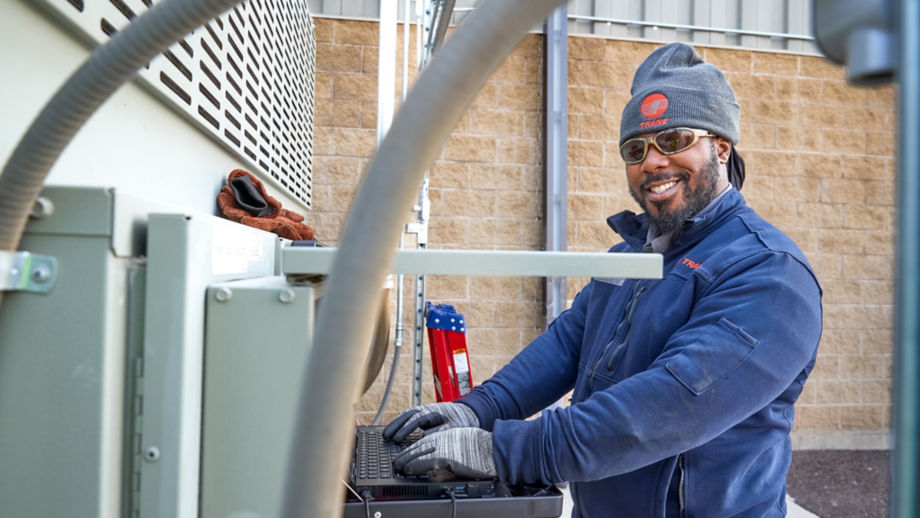 Male technician servicing unit 2