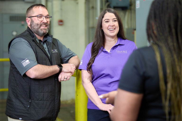 Employees talking in mechanical room