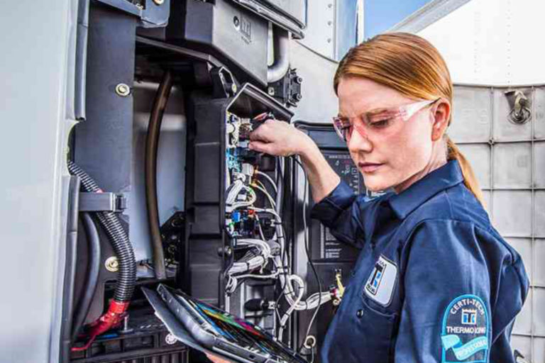 female maintenance technician working on a Thermo King unit
