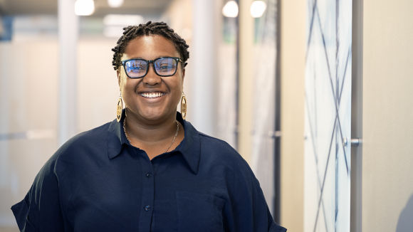Female employee laughing in hallway