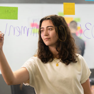 Female employee leading collaboration session 