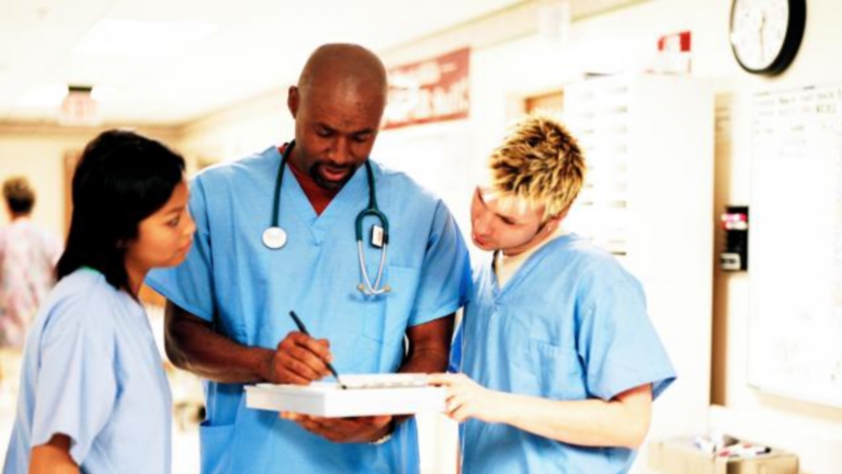 Hospital workers meeting in hallway