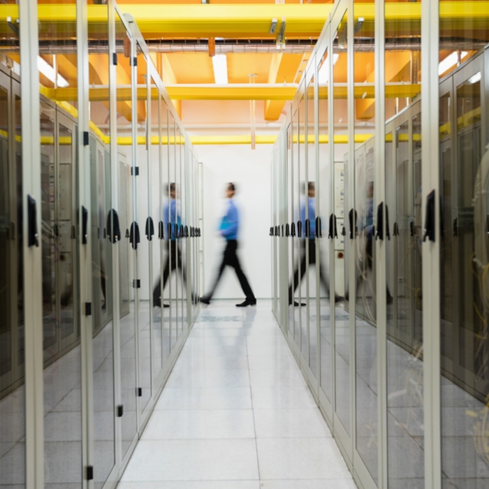 Technician walking in server room
