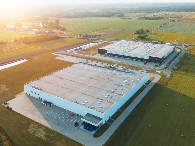 Distribution center surrounded by green fields