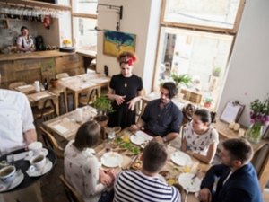 Group of friends having lunch in restaurant