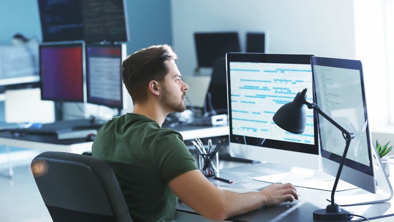 Male programmer working in office