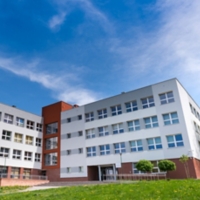 Public school building at sunny day, exterior view