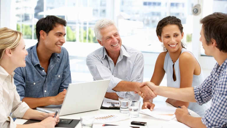 Group of people shaking hands