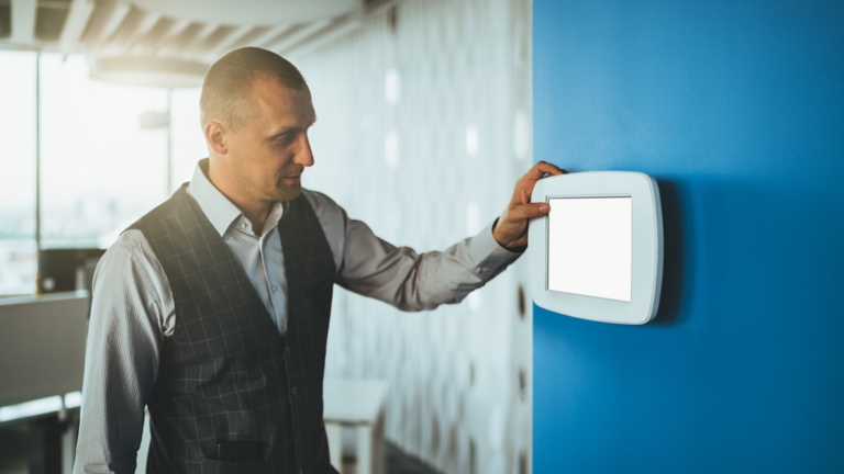 Businessman using electronic panel